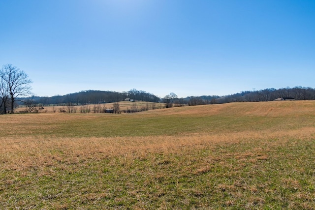 property view of mountains featuring a rural view