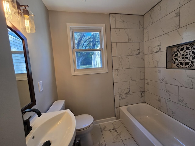 full bathroom featuring marble finish floor, toilet, baseboards, and a sink