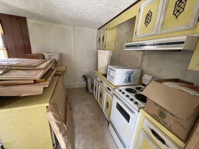 kitchen featuring light tile patterned floors, white electric range, under cabinet range hood, and a textured ceiling