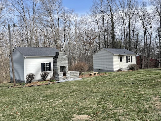 exterior space with an outdoor stone fireplace and entry steps