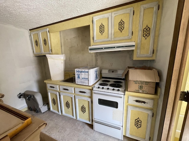 kitchen with electric range, light tile patterned flooring, light countertops, under cabinet range hood, and a textured ceiling