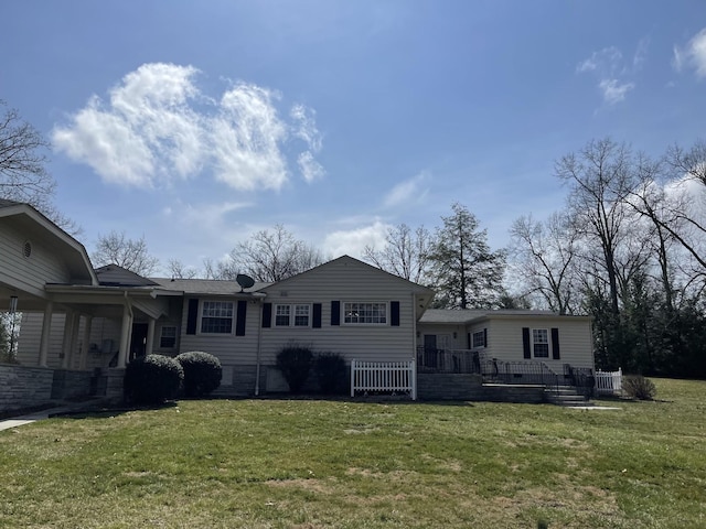 rear view of house with a lawn