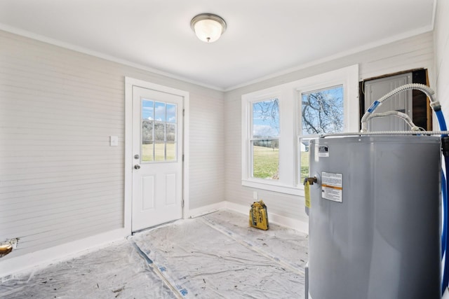 entryway featuring water heater and crown molding