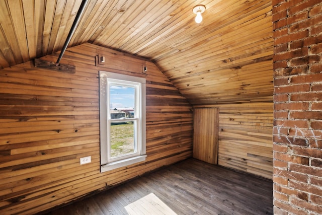 additional living space with dark wood-style floors, wooden walls, wood ceiling, and lofted ceiling