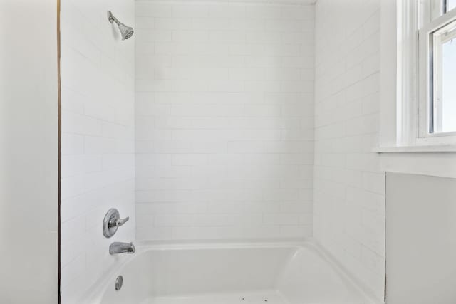 full bath featuring  shower combination