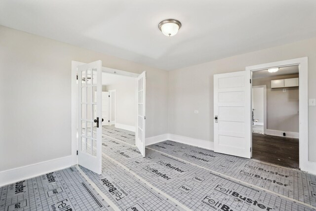 interior space with baseboards and tile patterned flooring