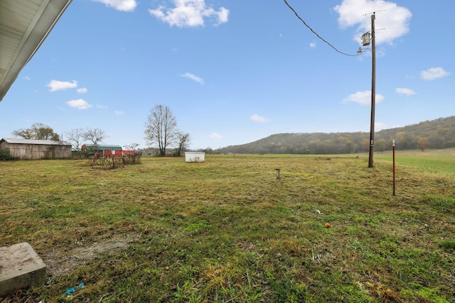 view of yard with a rural view