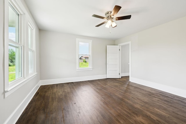 57 Young Branch Rd, Dixon Springs, TN 37057 - unfurnished room featuring dark wood finished floors, plenty of natural light, and baseboards