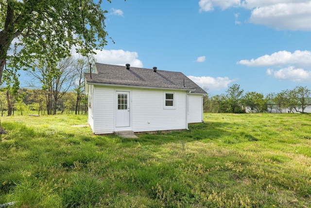57 Young Branch Rd, Dixon Springs, TN 37057 - rear view of house with a lawn and roof with shingles