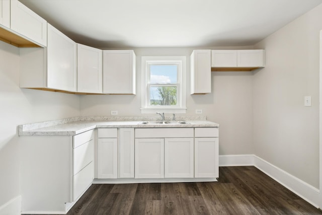 57 Young Branch Rd, Dixon Springs, TN 37057 - kitchen with white cabinets, baseboards, a sink, and dark wood-style flooring