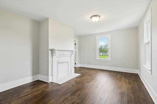 57 Young Branch Rd, Dixon Springs, TN 37057 - unfurnished living room with baseboards and dark wood-style floors