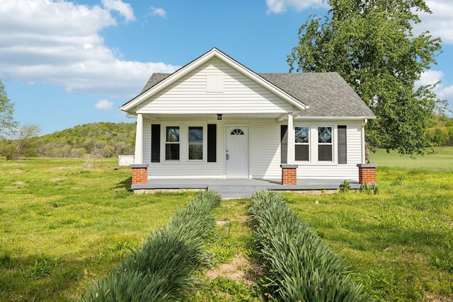 57 Young Branch Rd, Dixon Springs, TN 37057 - bungalow with a shingled roof, a front yard, and covered porch