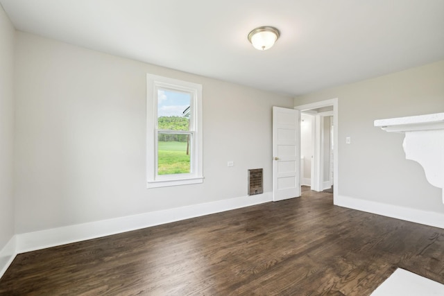 57 Young Branch Rd, Dixon Springs, TN 37057 - empty room featuring dark wood finished floors, visible vents, and baseboards