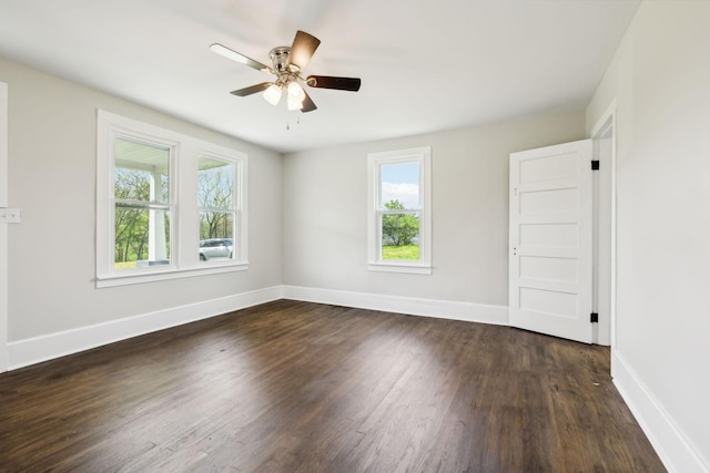 57 Young Branch Rd, Dixon Springs, TN 37057 - empty room with a wealth of natural light, dark wood-type flooring, and baseboards