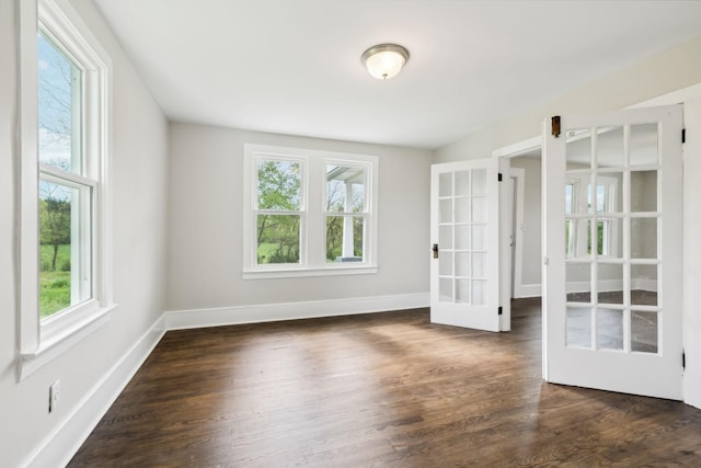 57 Young Branch Rd, Dixon Springs, TN 37057 - empty room with dark wood-style flooring, a healthy amount of sunlight, french doors, and baseboards