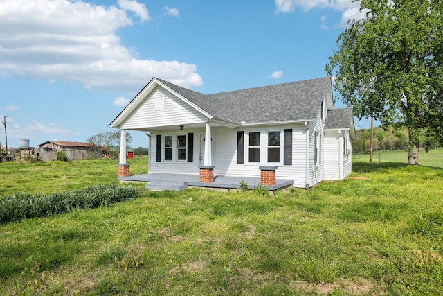 57 Young Branch Rd, Dixon Springs, TN 37057 - bungalow featuring roof with shingles, a porch, and a front yard