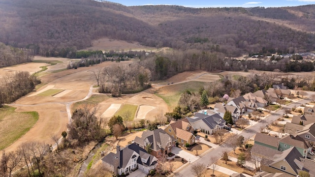 aerial view featuring a forest view and a residential view