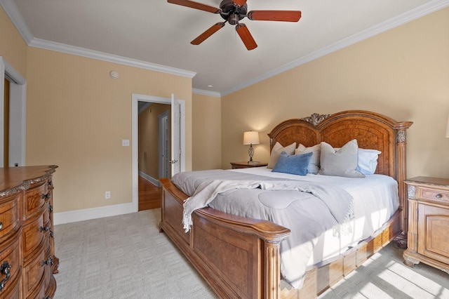 bedroom featuring baseboards, light carpet, a ceiling fan, and crown molding