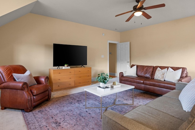 living room with vaulted ceiling, carpet, and ceiling fan