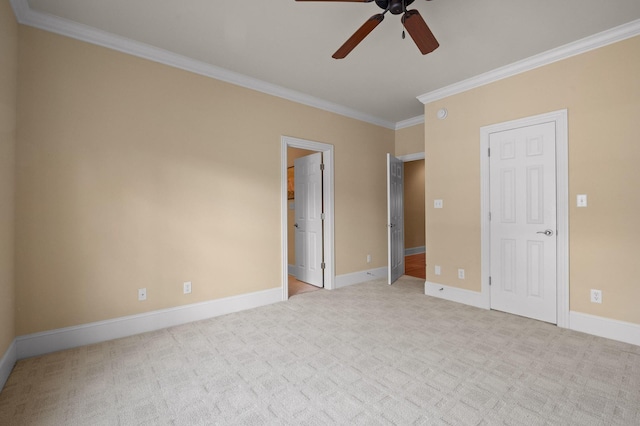 unfurnished bedroom with ornamental molding, baseboards, and light carpet