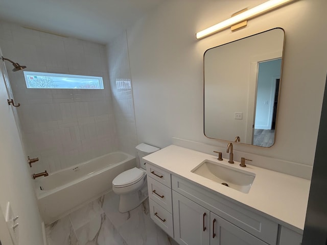 bathroom featuring marble finish floor, shower / bathtub combination, toilet, and vanity