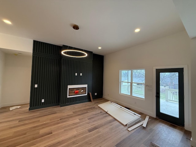 foyer with recessed lighting, light wood-style floors, and baseboards