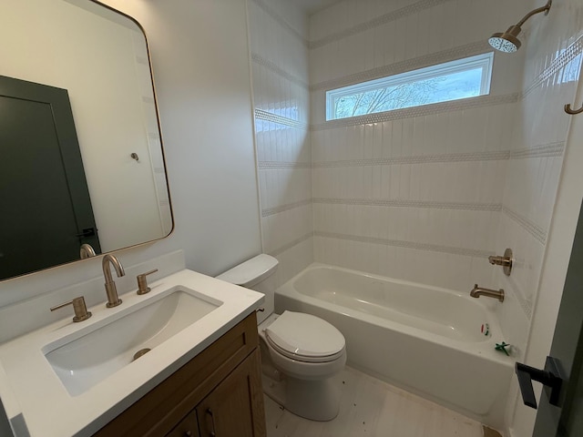 bathroom with vanity, toilet, and shower / bathtub combination