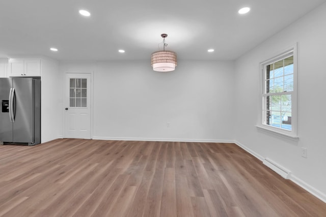 unfurnished dining area with recessed lighting, visible vents, light wood-style flooring, and baseboards