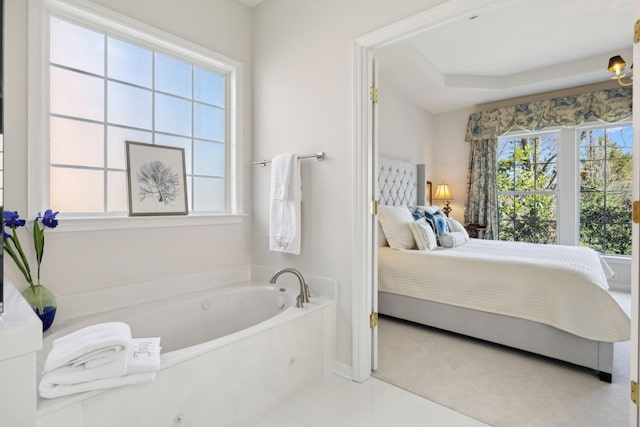 ensuite bathroom with ensuite bathroom and a garden tub