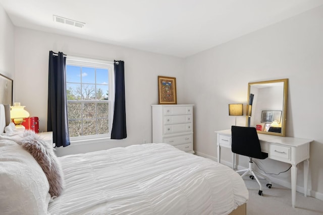 bedroom with visible vents, baseboards, and carpet flooring