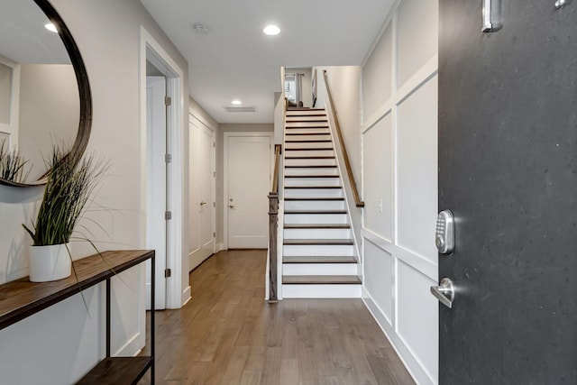 entryway with recessed lighting, stairway, visible vents, and light wood-style flooring