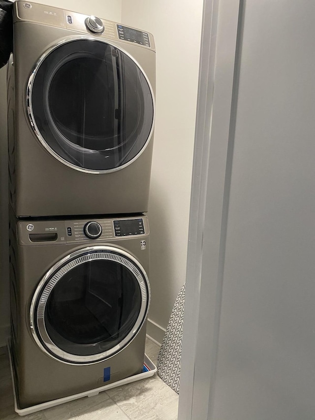 laundry room featuring laundry area and stacked washing maching and dryer