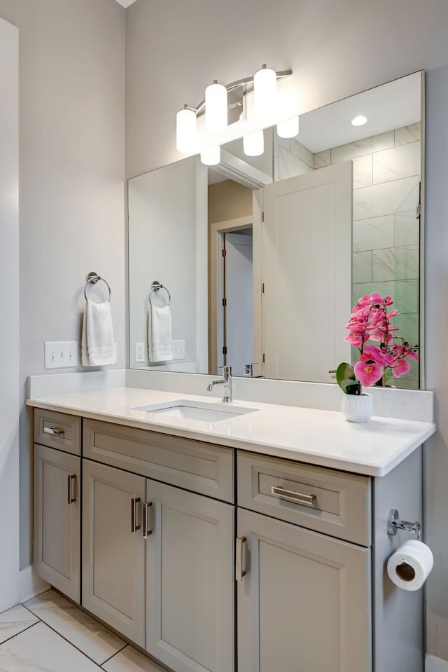 bathroom featuring vanity and marble finish floor