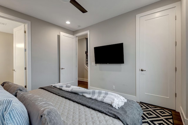 bedroom with a ceiling fan, recessed lighting, wood finished floors, and baseboards