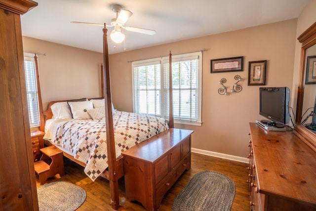 bedroom featuring dark wood-style floors, baseboards, and ceiling fan