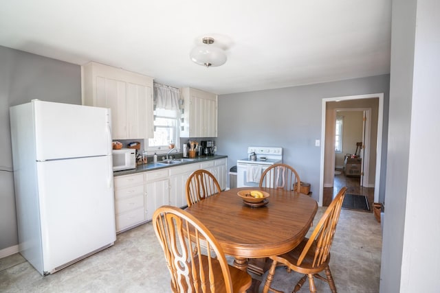 dining area featuring baseboards