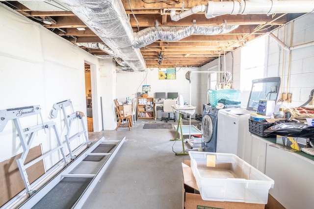 basement with independent washer and dryer and concrete block wall