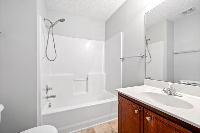 full bath with visible vents, toilet, a textured ceiling, bathtub / shower combination, and vanity