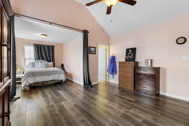 bedroom with dark wood finished floors, ceiling fan, high vaulted ceiling, and baseboards