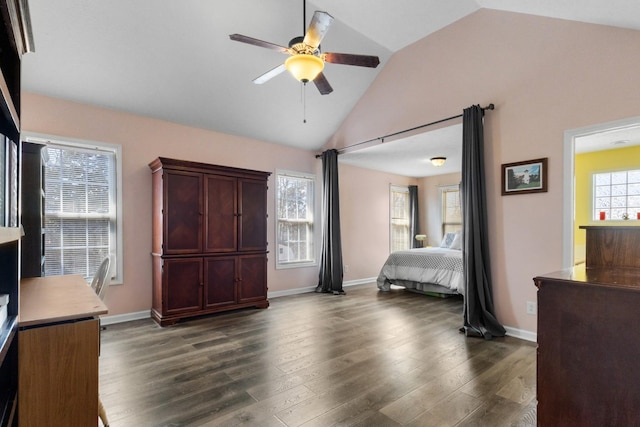 bedroom with baseboards, dark wood finished floors, and vaulted ceiling