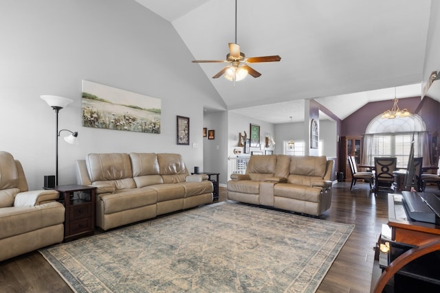 living room with high vaulted ceiling, dark wood finished floors, and ceiling fan with notable chandelier