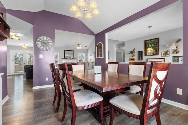 dining room featuring dark wood-style floors, baseboards, and lofted ceiling