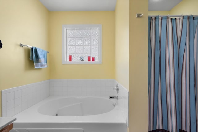 bathroom with curtained shower and a bath