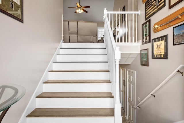 stairs with ceiling fan