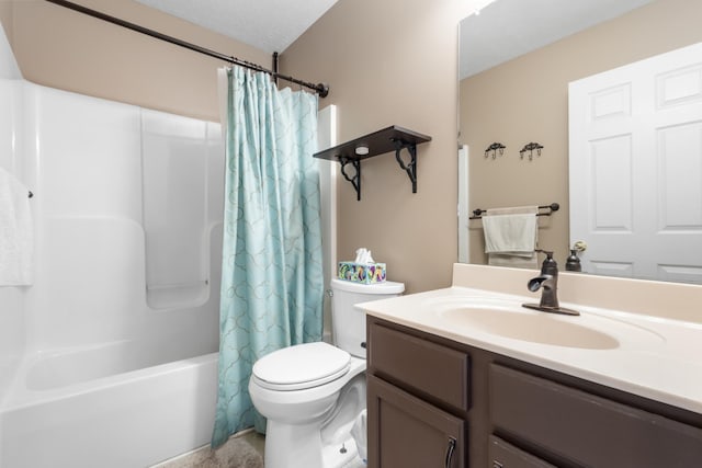 full bath featuring vanity, toilet, shower / tub combo, and a textured ceiling