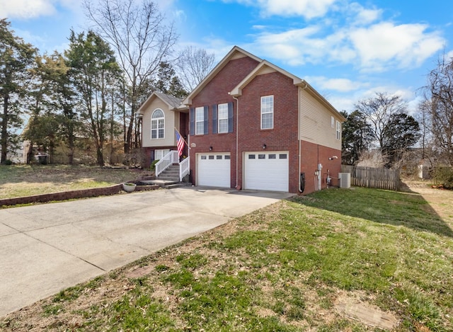 view of front of home with a front yard, concrete driveway, a garage, central air condition unit, and brick siding