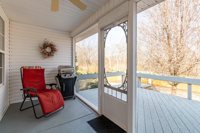 sunroom with a ceiling fan and a wealth of natural light