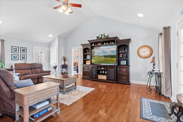 living room with baseboards, recessed lighting, wood finished floors, high vaulted ceiling, and a ceiling fan