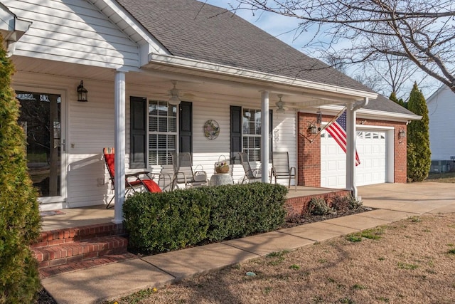 view of front of property with a shingled roof, concrete driveway, covered porch, a garage, and a ceiling fan