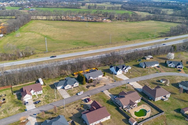 drone / aerial view featuring a rural view and a residential view